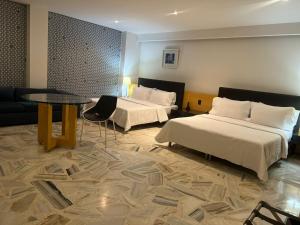 Posteľ alebo postele v izbe v ubytovaní Aw Hotel Luxor Versalles