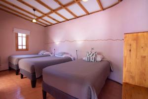 Voodi või voodid majutusasutuse Hotel-Camping Takha Takha toas