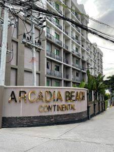a hotel sign in front of a building at Brand New 1Bdr Condo! 5 minutes from Famous Walking Street! in Pattaya South