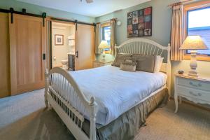 a bedroom with a white bed and a window at 523 S Cache in Jackson