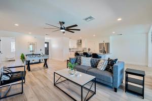 a living room with a couch and a table at Luxury Old Town Scottsdale Home with Pool King Bed & Putting Green - Casa Gram in Scottsdale