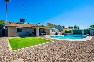 a house with a swimming pool in a yard at Luxury Old Town Scottsdale Home with Pool King Bed & Putting Green - Casa Gram in Scottsdale