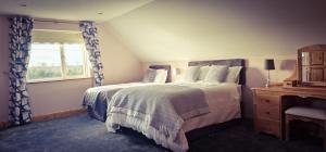 Ein Bett oder Betten in einem Zimmer der Unterkunft LittleField B&B Durrow, Laois