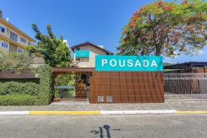 a sign that reads pousada in front of a building at Nova Pousada dos Chás in Florianópolis