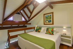 a bedroom with a large bed in a attic at Nova Pousada dos Chás in Florianópolis +101 photos