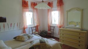 A bed or beds in a room at Agriturismo Le Spezie
