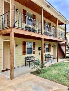 a house with a deck and a balcony at Trinity One Apartments - Country Luxury in Jackson
