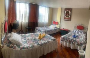 Postel nebo postele na pokoji v ubytování Hostal Jora Continental