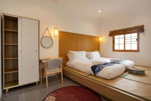 Кровать или кровати в номере Villa Sunrise Garden B190