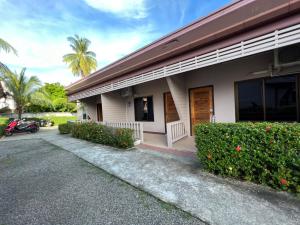 a building with a car parked in front of it at The Passion Nest - SHA Plus Certified in Phuket