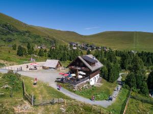 an aerial view of a house in the mountains at Zirbenhütte am Falkert auf der Heidi-Alm in Koflach