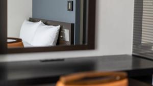 Postel nebo postele na pokoji v ubytování Hotel Vista Ebina