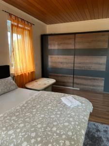 a bedroom with a bed and a sliding glass door at Pension Rüge in Frankfurt