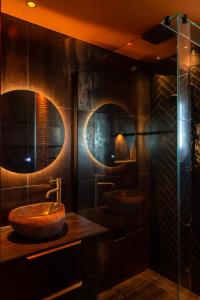 a bathroom with two sinks and a glass shower at The Upside Down in Nelson