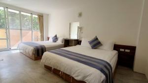 Postel nebo postele na pokoji v ubytování Xitou Tianpin Homestay