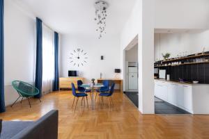 a kitchen and dining room with a table and chairs at SZ9 Szent István Apartment in Budapest