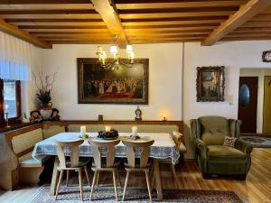 a dining room with a table and chairs at Casa Ema Austria in Ramingstein