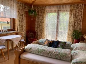 a living room with a couch and a table at Haus Brugger in Rennweg