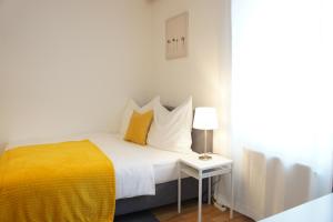 Posteľ alebo postele v izbe v ubytovaní Schwarzacherhof Pension & Apartments