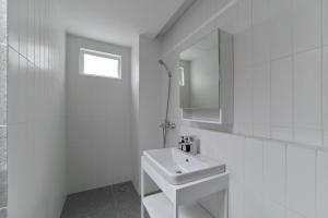 Koupelna v ubytování M Village Living Cao Thắng + 21 fotografií
