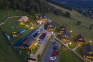 an aerial view of a house with a parking lot at Osada Na Ochodzitej in Koniaków