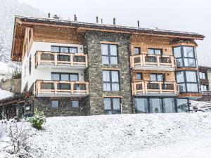 a building covered in snow in front at Panorama Ski Lodge in Zermatt