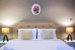Postel nebo postele na pokoji v ubytování Prime Retreats- Downtown Dubai