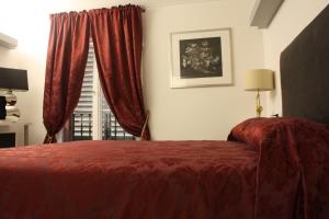 Ένα ή περισσότερα κρεβάτια σε δωμάτιο στο Appartamento Biba