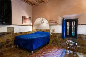 Ένα ή περισσότερα κρεβάτια σε δωμάτιο στο Hôtel Riad Dar Daïf