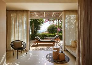 a living room with a couch and a table at F Zeen Kefalonia in Lourdhata