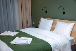Voodi või voodid majutusasutuse Hotel 1700 toas