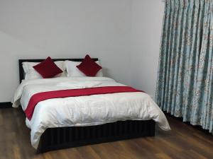Rúm í herbergi á Cocina Mitho Chha BNB