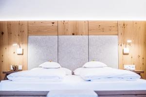 Voodi või voodid majutusasutuse Hotel Residence Rose toas