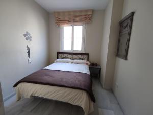 Posteľ alebo postele v izbe v ubytovaní Flamingo Sol Home