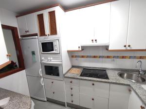 Kuchyňa alebo kuchynka v ubytovaní Flamingo Sol Home