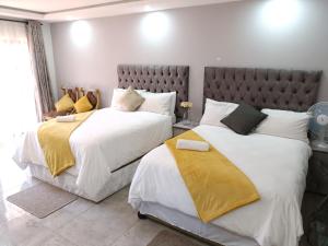 Кровать или кровати в номере EYEZULU Guesthouse