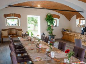a large dining room with a long table and chairs at Kummers Motel in Völkermarkt