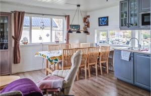 a kitchen and dining room with a table and chairs at Cozy Home In Egersund With Wifi in Egersund