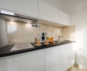 Kuchyňa alebo kuchynka v ubytovaní Apartments - Villa Sabrina