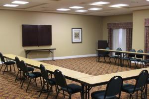 a conference room with tables and chairs and a podium at Holiday Inn Express and Suites Thomasville, an IHG Hotel in Thomasville