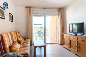 TV a/nebo společenská místnost v ubytování Apartamentos Bovalar Casa Azahar