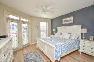 a bedroom with a bed and a ceiling fan at Seaside At Anastasia 202 Condo in Saint Augustine +39 photos