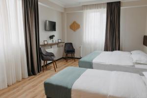 Voodi või voodid majutusasutuse GABATA INN toas