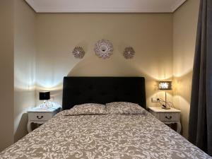 Łóżko lub łóżka w pokoju w obiekcie Apartamento Axpelarru