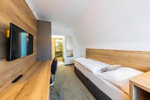 Postel nebo postele na pokoji v ubytování Hotel SKI