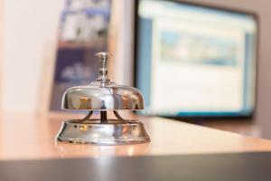 a silver bell sitting on top of a counter at Villa Osada in Binz