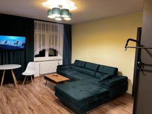 Telewizja i/lub zestaw kina domowego w obiekcie Komfortowy Apartament w centrum