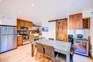 a large kitchen with a wooden table and chairs at Juanita by the Bay in Incline Village