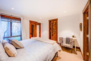 a bedroom with a bed and a window at Juanita by the Bay in Incline Village