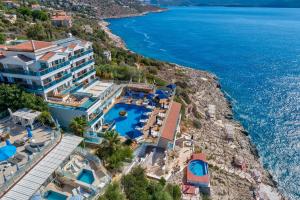 an aerial view of the hotel and the ocean at Meis Exclusive Hotel in Kaş